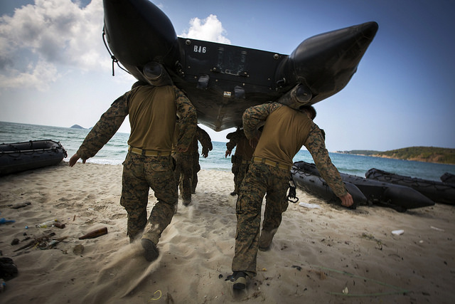 Marines shoulder-carry a boat to water during an amphibious operations familiarization drill as part of Exercise Cobra Gold 2014 at Hat Yao beach, Rayong, Kingdom of Thailand. (Photo: Sgt. Matthew Troyer/Released)