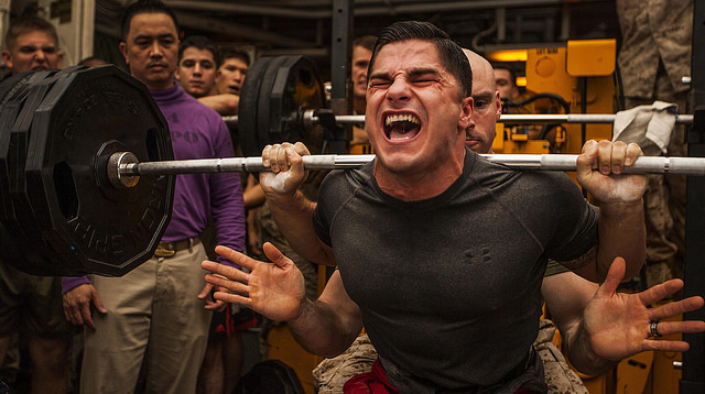 Staff Sgt. Jace Manning squats 385 pounds during a weight-lifting competition aboard the USS Bataan (LHD 5). (Photo: Sgt. Austin Hazard/Released)