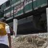 Central Americans walk to a cargo train called "The Beast" in their attempt to reach the U.S. border with Mexico. (Photo: Newscom)