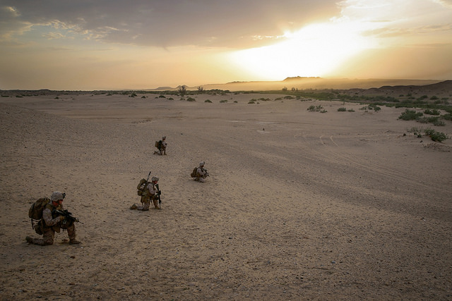 Marines with Bravo Company, 1st Battalion, 7th Marine Regiment, provide outboard security after offloading from a CH-53E Super Stallion helicopter during a mission in Helmand province, Afghanistan, May 1, 2014. The company operated in Tagvreshk Village, an area with suspected Taliban forces with the intent to disrupt any lethal aid. (Photo: Cpl. Joseph Scanlan/Released)