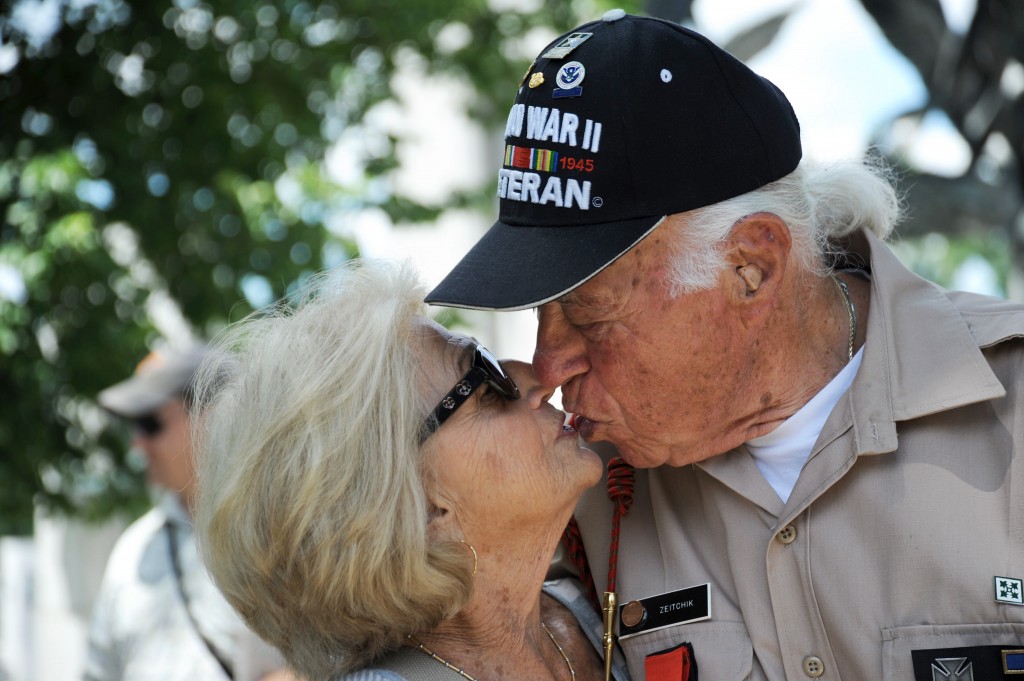 A veteran an his wife share a kiss near the World War II memorial on June 7, 2014. (Photo: Katherine Cresto/CC BY-NC 2.0)