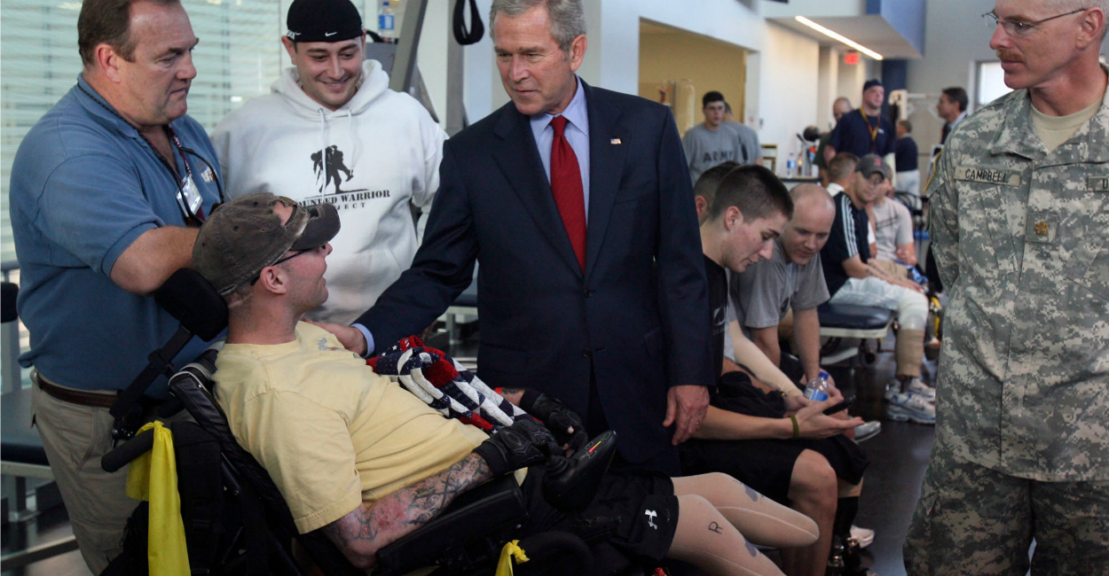 George W. Bush visits with Army Sgt. Nicholas McCoy at the Center for the Intrepid at Brooke Army Medical Center in San Antonio. (Photo: John Davenport/ZUMAPress/Newscom)