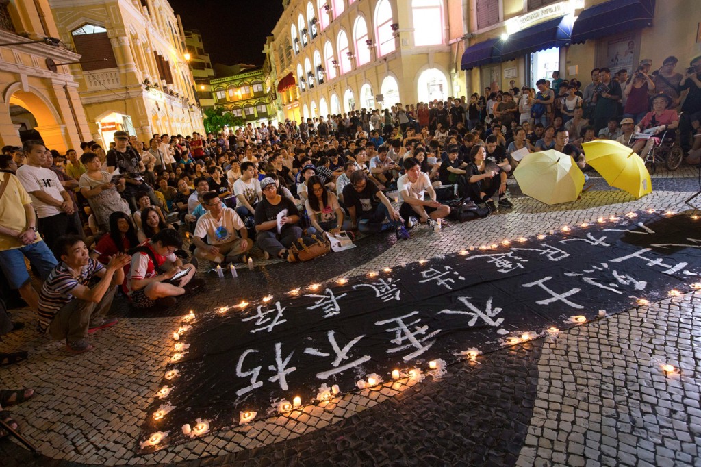 People attend a vigil in memory of the victims of the Tiananmen massacre, in Macau, China, 04 June 2015, marking the 26th anniversary of the government crackdown on pro-democracy demonstrations at Tiananmen Square. (Photo: CARMO CORREIA/EPA/Newscom)