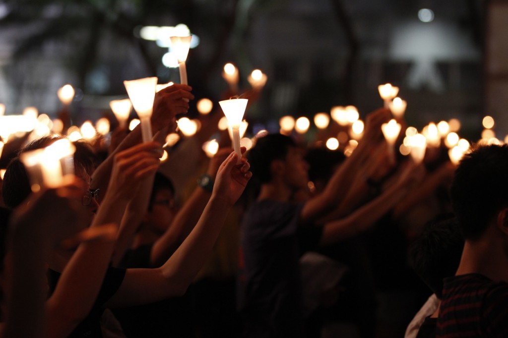 Participants take part at the candlelight vigil as they hold candles in Victoria Park on June 4, 2015 in Causeway Bay, Hong Kong, just months after their own pro-democracy protests. (Photo: David G. Mcintyre/ZUMA Press/Newscom)