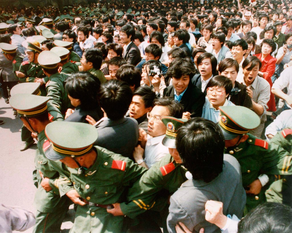 Crowds of jubilant students surge through a police cordon before pouring into Tiananmen Square during a pro-democracy demonstration in this June 4, 1989 photo. (Photo: STRINGER/REUTERS/Newscom)