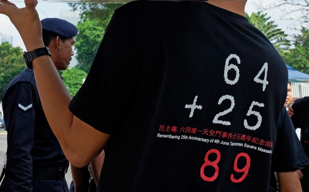 A protester wears a shirt showing numbers significant to the Tiananmen Square tragedy during a protest in front of the Chinese Embassy in Kuala Lumpur, Malaysia, 04 June 2014. The protest was held last year to commemorate the 25th anniversary of the Tiananmen Square tragedy where China's military did a crackdown on pro-democracy protesters in 1989. (Photo: SHAMSHAHRIN SHAMSUDIN/EPA/Newscom)