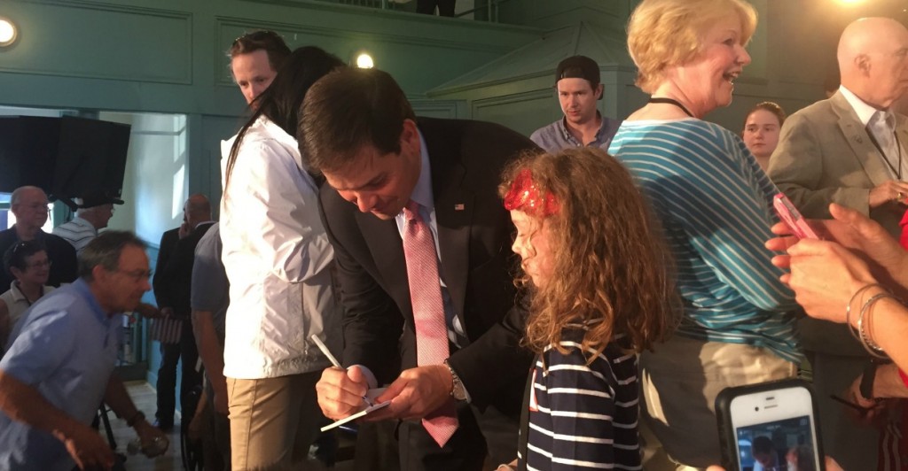 Sen. Marco Rubio, R-Fla., signs an autograph at a town hall in Exeter, N.H. (Photo: Kate Scanlon/The Daily Signal)