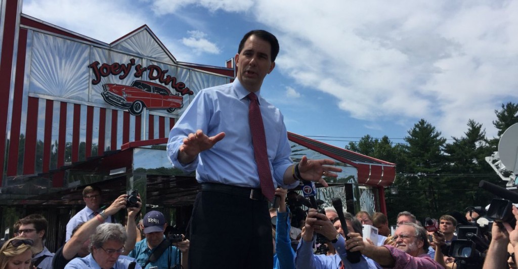 Wisconsin Gov. Scott Walker, a Republican Presidential candidate, stands on the back of a pickup truck to address an overflow crowd outside his campaign stop in Amherst, N.H. (Photo: Kate Scanlon/The Daily Signal)