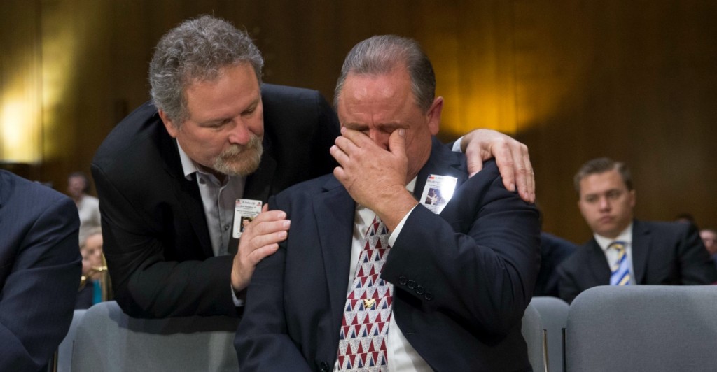 During a Senate hearing, George Wilkerson, whose son Josh was murdered by an undocumented immigrant, is comforted by Don Rosenberg, whose son Drew was killed by an unlicensed driver in the U.S. illegally. (Photo: Michael Reynolds/EPA/Newscom)