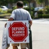 A protester leaves after demonstrating outside a Planned Parenthood clinic in Vista, California, Aug. 3. (Photo: Mike Blake/Reuters/Newscom)