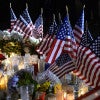 Flags surround a makeshift memorial outside the government building where Syed Farook and wife Tashfeen Malik shot and killed 14 in San Bernardino, Calif.  (Photo: Mike Nelson/EPA/Newscom)