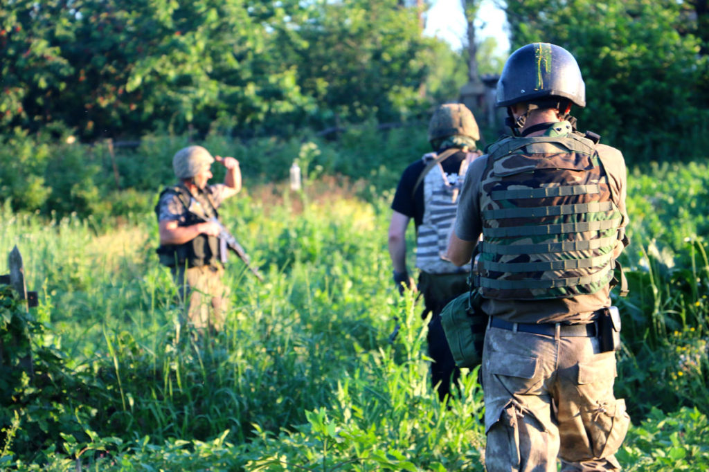 Ukrainian soldiers on patrol in the eastern Ukrainian town of Pisky. (Photo: Nolan Peterson/The Daily Signal)