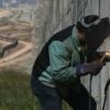 A welder fixes a damaged section of the border fence in California. (Photo: Peggy Peattie/TNS/Newscom)
