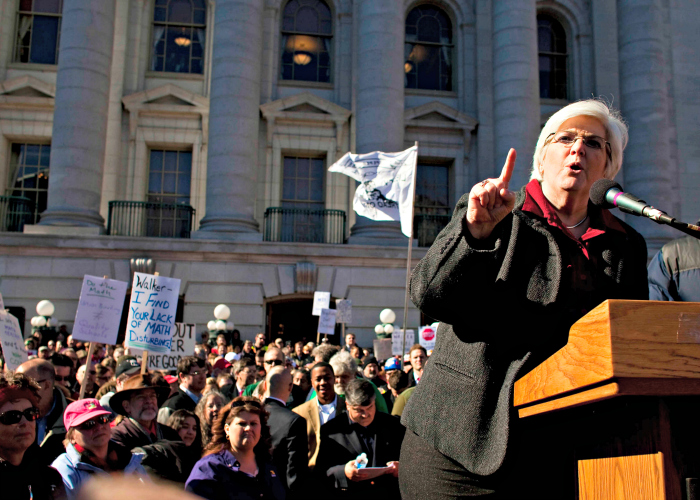 Mary Bell, president of the Wisconsin Education Association Council, speaks to protesters crowding the State Capitol grounds in Madison as Wisconsin lawmakers discuss Gov. Scott Walker's budget bill on Feb. 18, 2011. (Photo: Darren Hauck/Reuters/Newscom)
