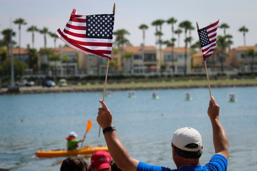A patriotic supporter cheers on kayakers. (Photo: Flickr/SpecialOlympicsUSA)