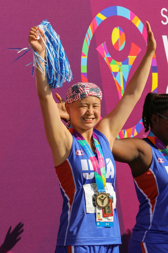 Olivia Quigley won the gold medal for the 100-meter competition, as she wore an American flag scarf over her head. Quigley has been going through chemotherapy for breast cancer. (Photo: Flickr/SpecialOlympicsUSA)