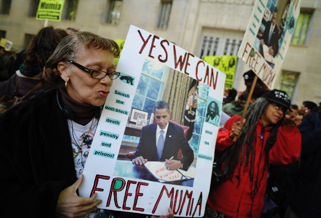 Protestors at a rally for convicted cop-killer Mumia Abu-Jamal. (Credit: MANDEL NGAN/AFP/Getty Images/Newscom)