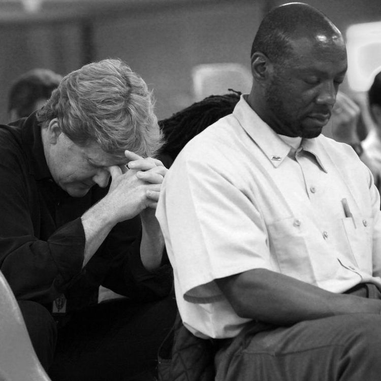 'The least of the least': B. Wayne Hughes Jr. prays with inmates at California's Centinela State Prison (Photo: Serving California)