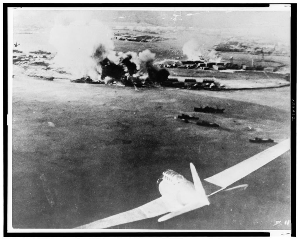 Aerial photograph, taken by a Japanese pilot, of the destruction of Pearl Harbor, Japanese bomber in lower right foreground. (Photo: Library of Congress Prints and Photographs)
