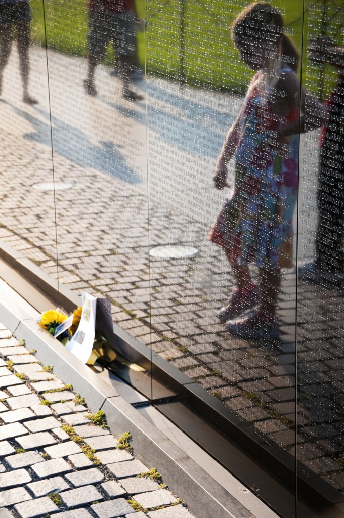 A child's silhouette is reflected in the surface of the Vietnam Wall. (Photo: Getty Images)