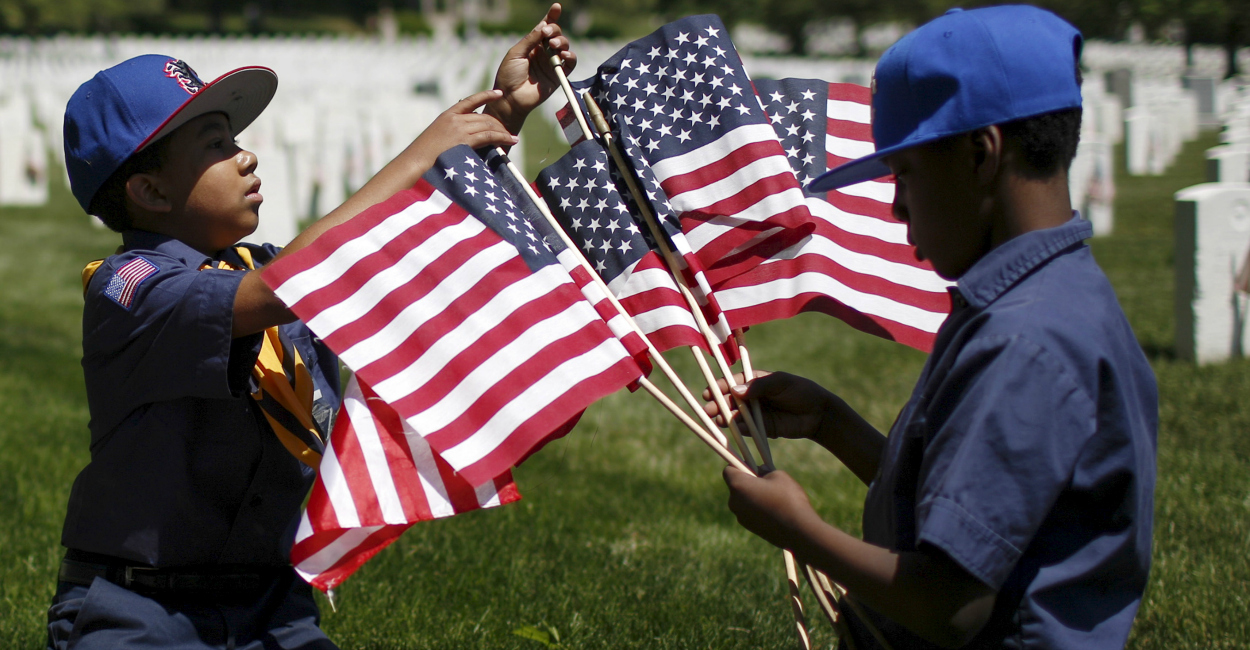 Boy Scouts of America organize U.S. flags to be placed at graves at Cypress Hills National Cemetery in Brooklyn, New York. (Photo: Eduardo Munoz/Reuters/Newscom)