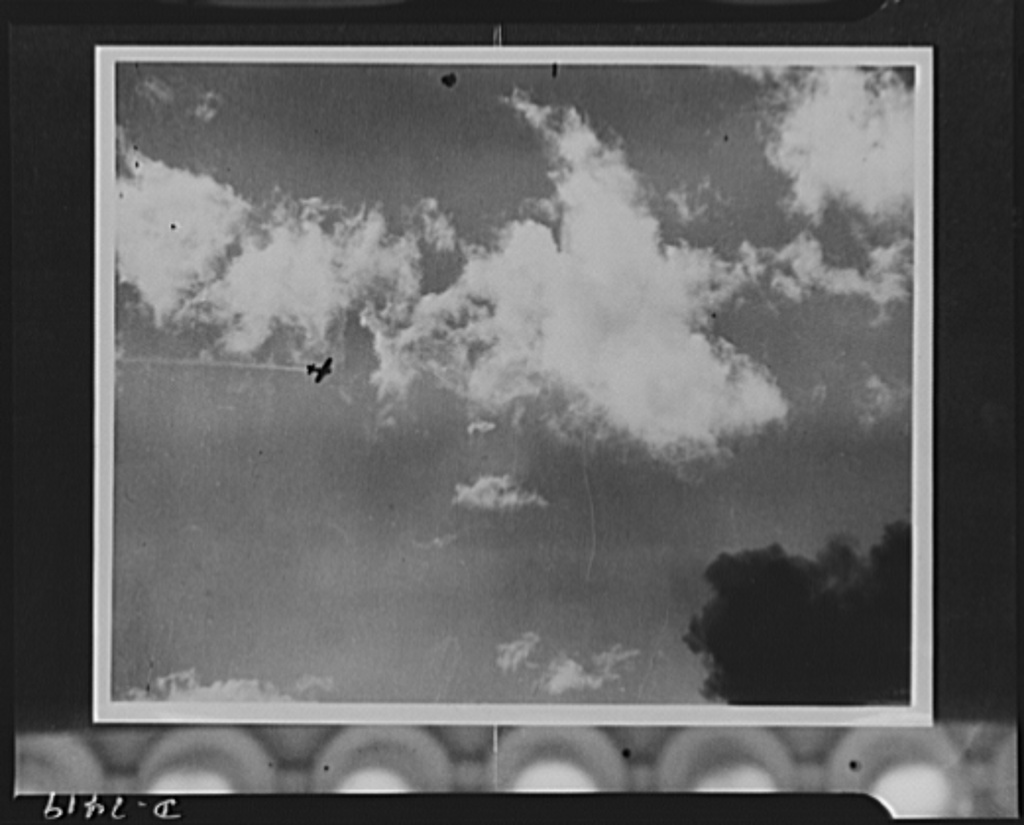 The Japanese bomber, a thin line of smoke trailing in the wake, was struck by anti-aircraft fire during the attack on Pearl Harbor. (Photo: Library of Congress Prints and Photographs)