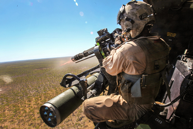 Sgt. Brian D. Richardson, a 29-year-old crew chief for Marine Medium Tiltrotor Squadron 265 (Reinforced), 31st Marine Expeditionary Unit, fires a 7.62mm GAU-17/A weapon system at enemy targets from a UH-1Y Venom helicopter during live-fire training as part of Exercise Koolendong. (Photo: Sgt. Paul Robbins/Released)
