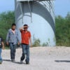 A U.S. Border Patrol agent escorts a group of Central American immigrants following their surrender after illegally entering the country from Mexico. (Photo: Paul Hennessy/Polaris/Newscom)