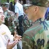 Army Chaplain, Father Joseph Angotti, talks with a soldier following mass at the Regimental Chapel on Sand Hill in Fort Benning, Ga.  (Photo: ROBIN TRIMARCHI/KRT/Newscom)