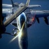 A U.S. fighter jet refuels from an Air Force KC-135 Stratotanker Aug. 21., 2014 over the Central Command area of responsibility. (Photo: Staff Sgt. Shawn  Nickel / Flickr / Edited Daily Signal / CC BY-NC 2.0)