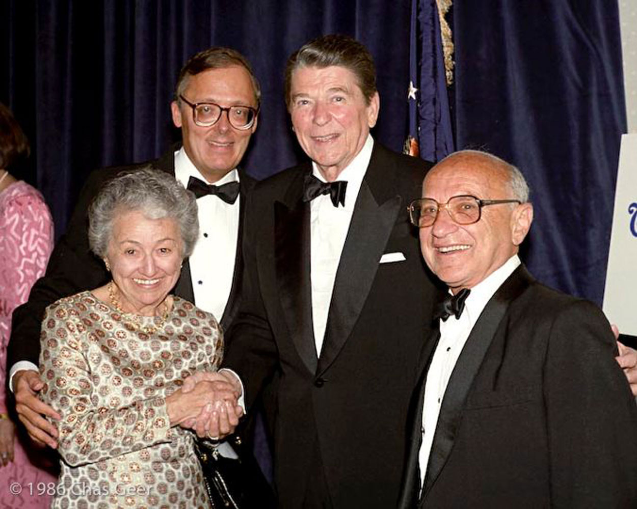 Ed Feulner and President Ronald Reagan are flanked by Rose and Milton Friedman in 1986. (Photo: Charles Geer for The Heritage Foundation)