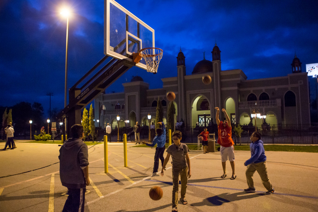 Children play basketball before the evening prayer at the The Maryam Islamic Center in Sugar Land, Texas. (Photo: Scott Dalton)