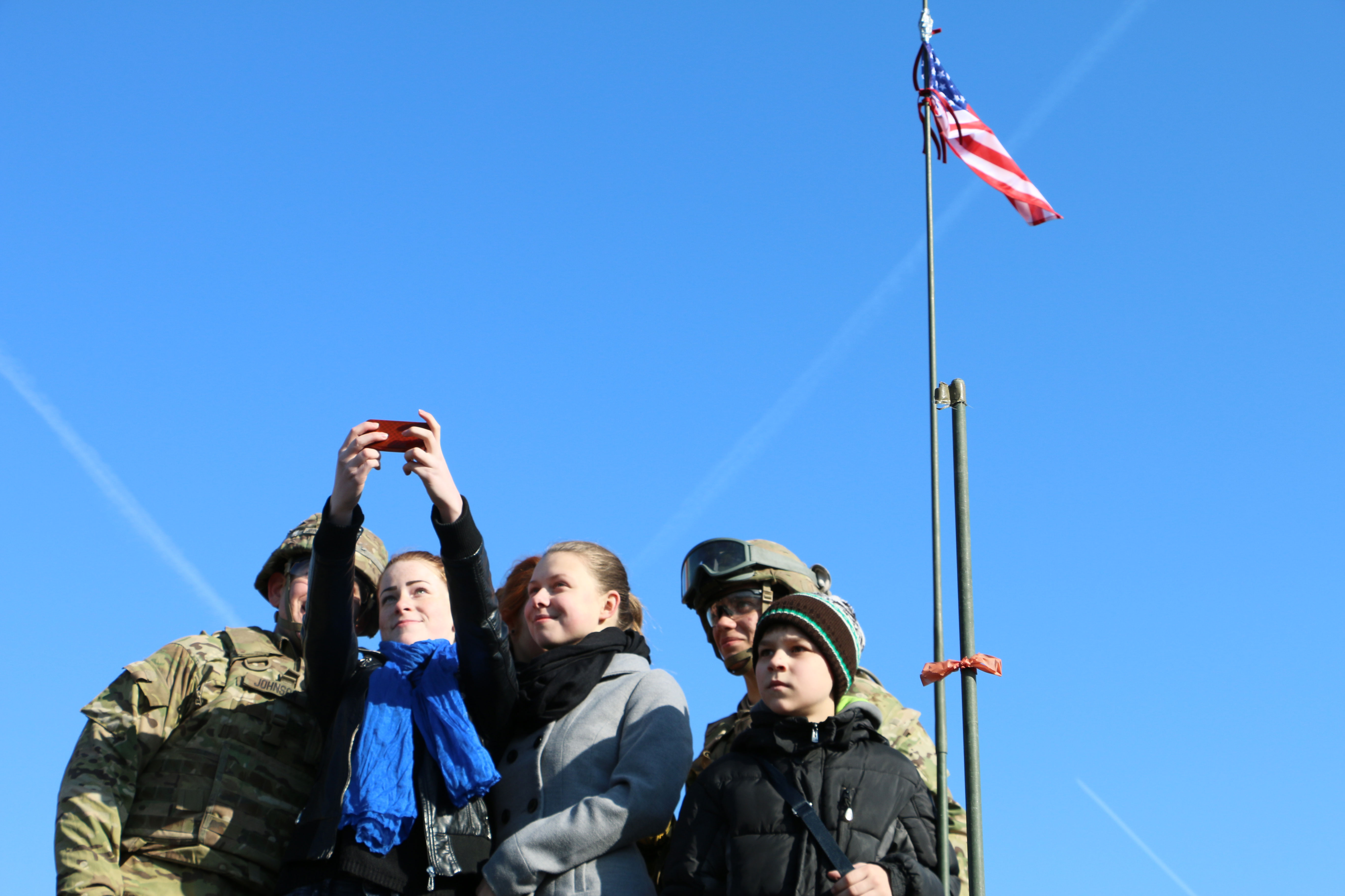 Lithuanians greet U.S. Army soldiers.
