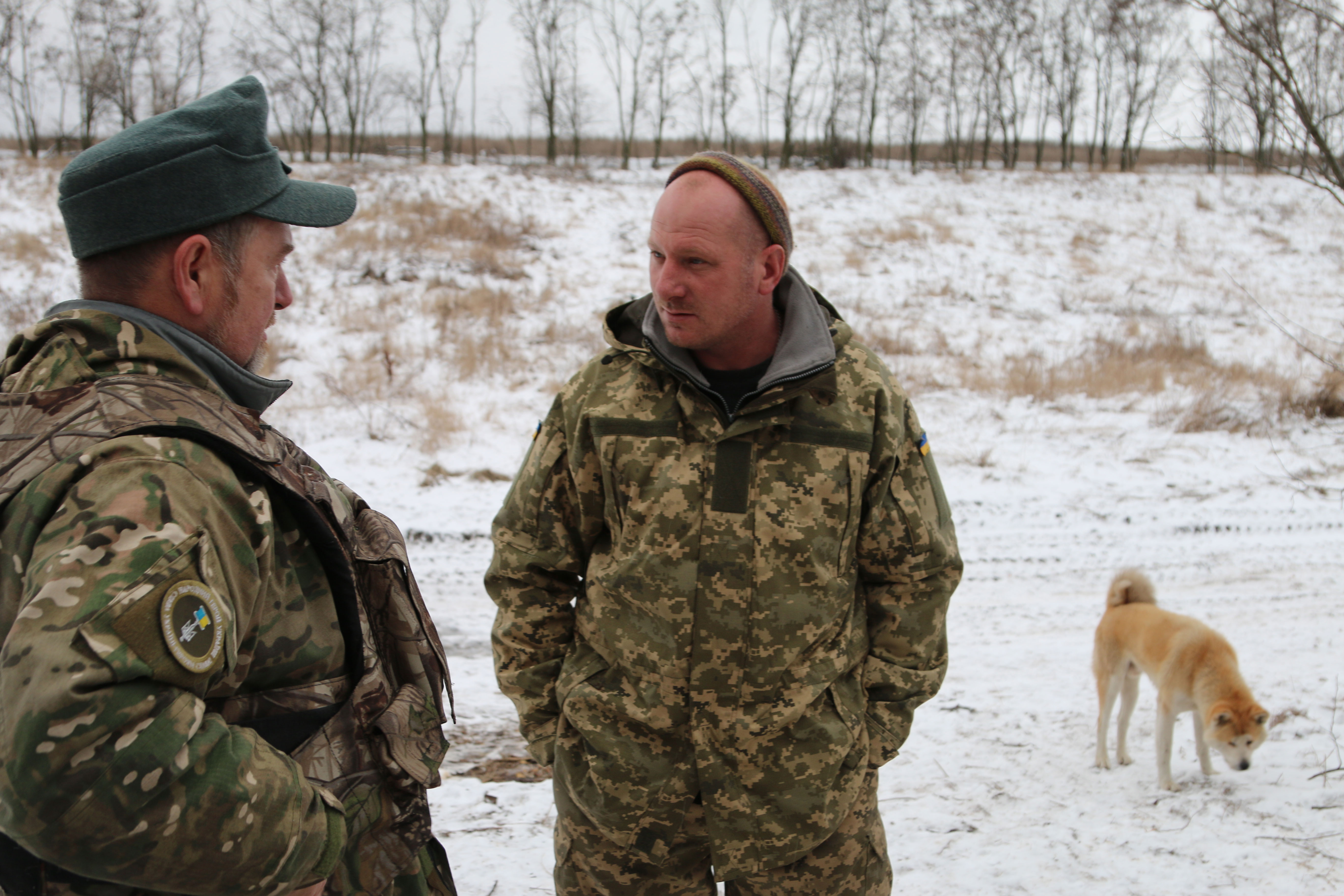 Ukrainian civilian volunteer Edward Kulinich, left, speaks with Moscow. (Photos: Nolan Peterson/The Daily Signal)