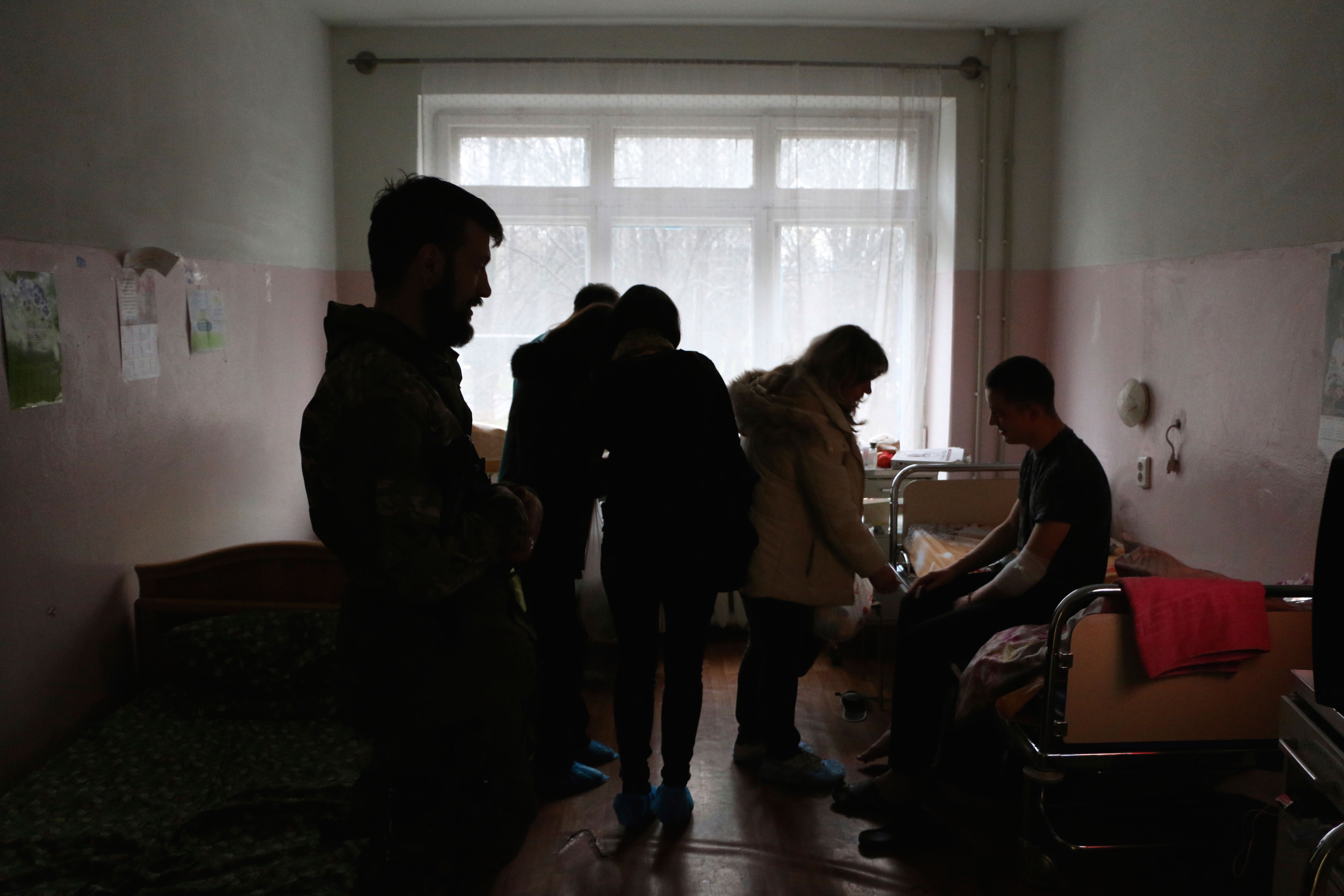 Ukrainian women deliver supplies to wounded soldiers at a hospital in Mariupol.