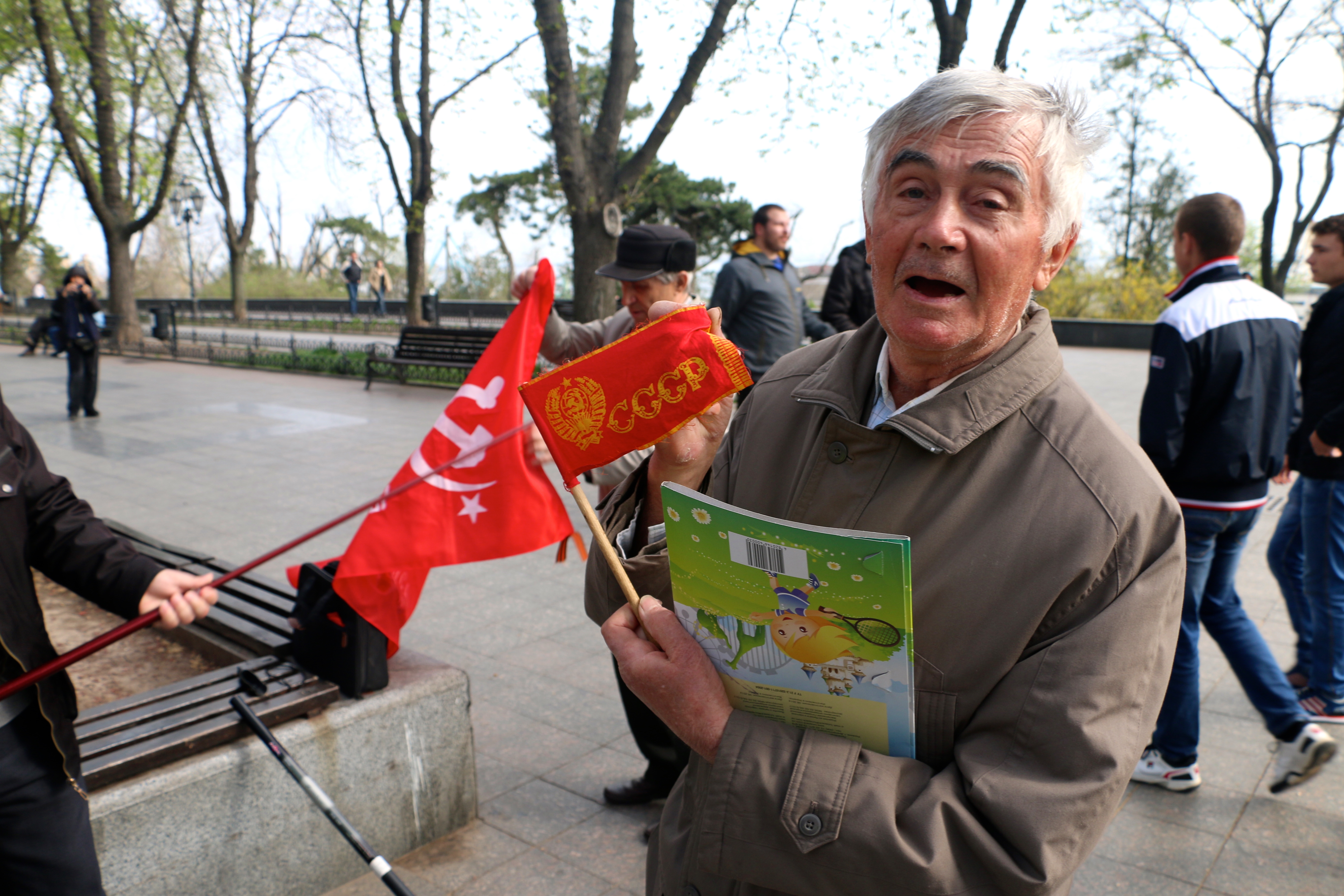 A Communist Party member with a Soviet flag in Odessa, Ukraine. (Photo: Nolan Peterson/The Daily Signal)