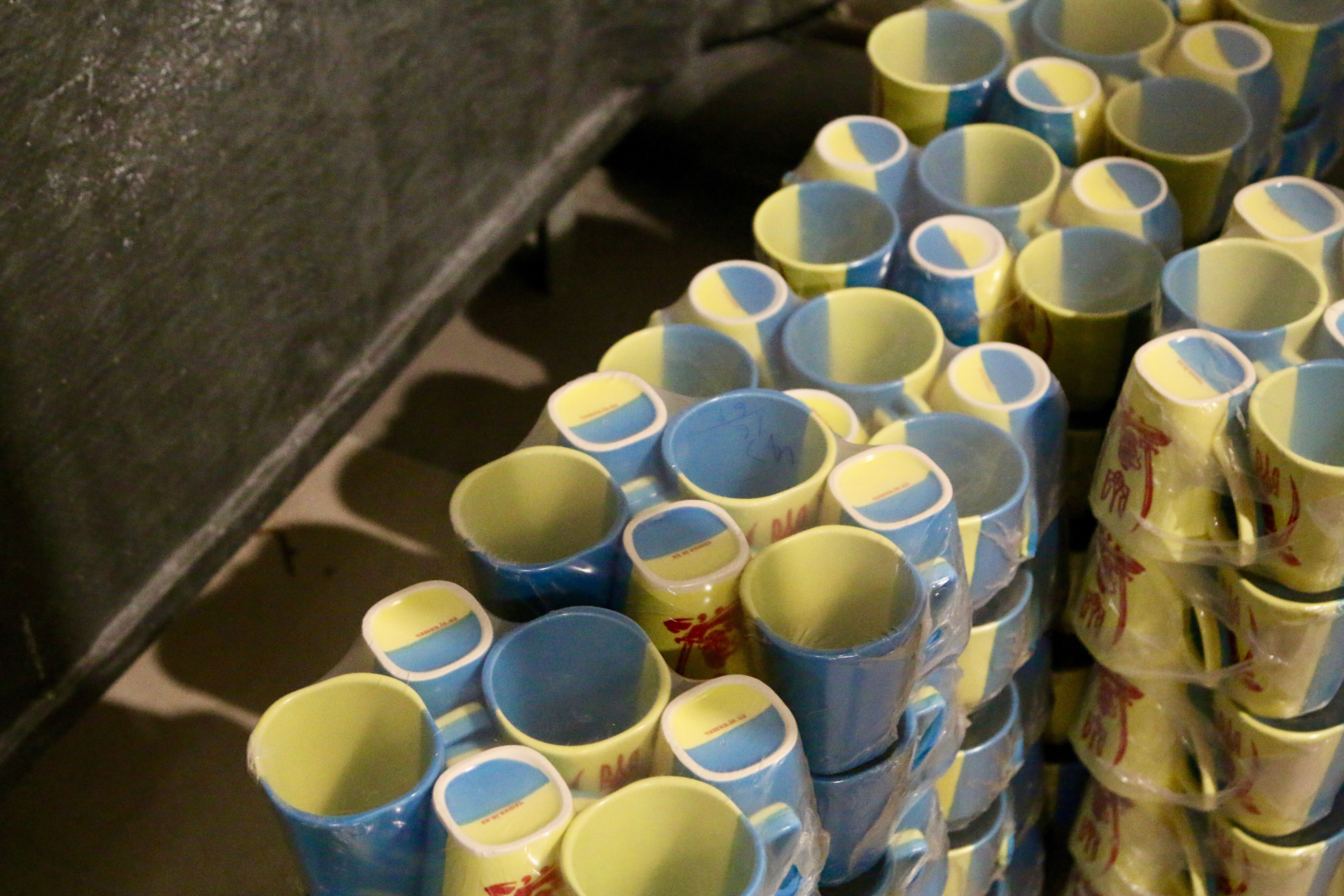 Olexandr Ivanovich Poligenko’s blue and yellow coffee mugs—Ukraine’s national colors—have become ubiquitous throughout the war zone.