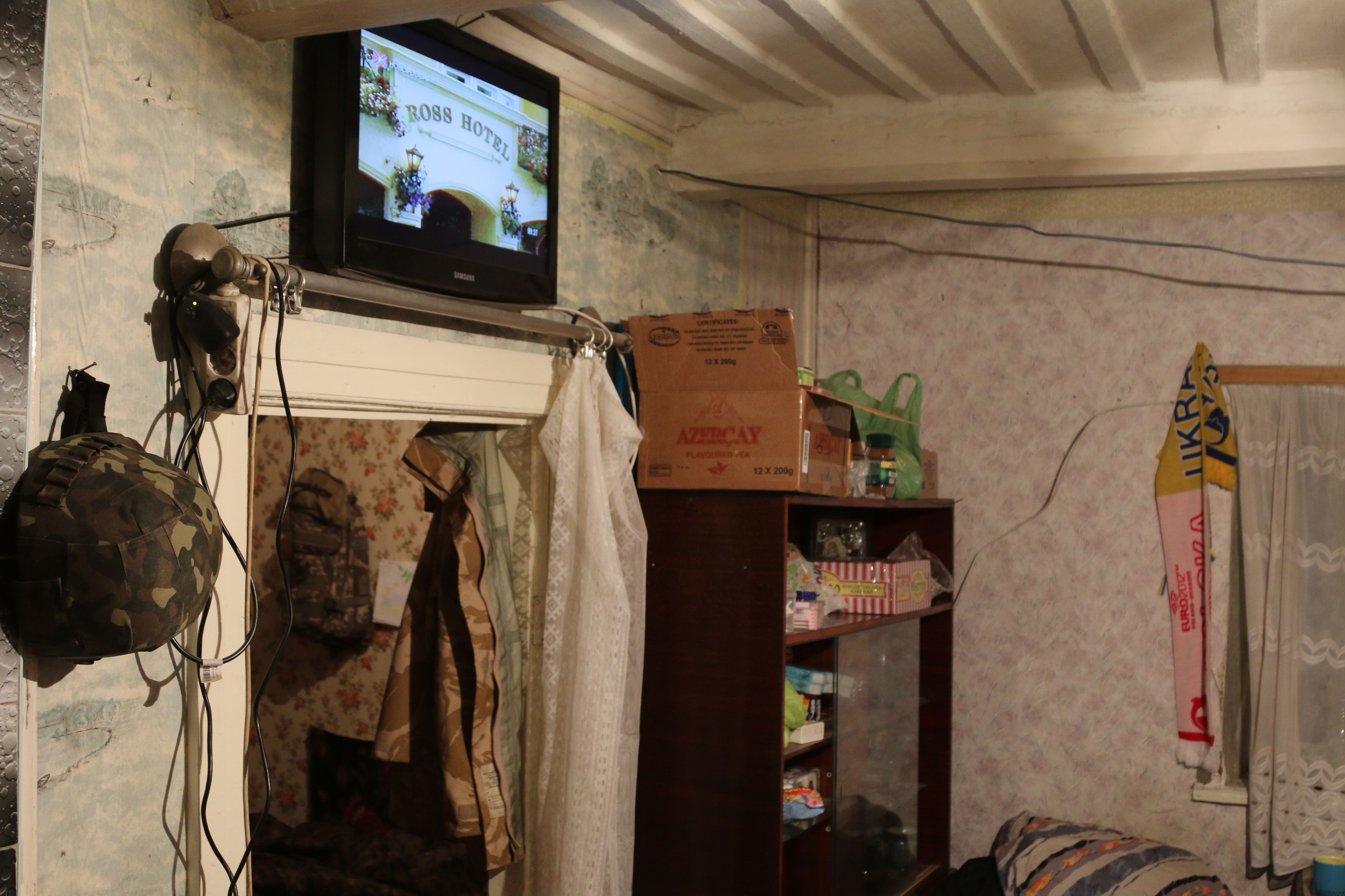 Inside the Aidar Battalion outpost in Taramchuk, a TV is tuned to Russian stations. 