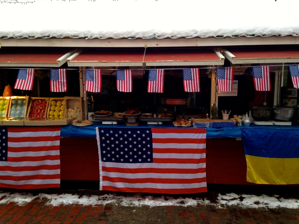 Flags on display in Kyiv’s Christmas market. (Photo: Nolan Peterson/The Daily Signal)