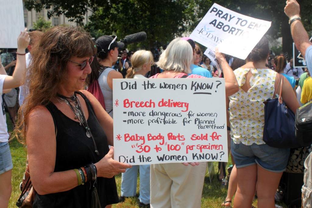 Shagan shows off her sign and spoke of her opinion on Planned Parenthood. “I don’t want to support it. It’s a big business. Why can’t they stand and fall on their own? Why do taxpayers have to give money to this?” Shagan said. (Photo: Samantha Reinis/The Daily Signal) 