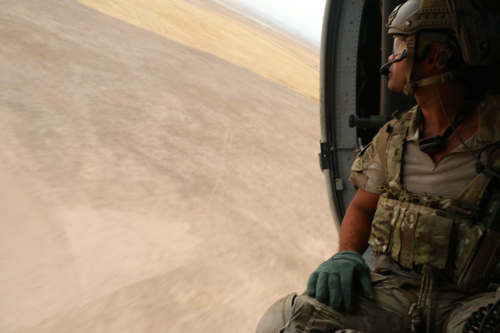 An Air Force pararescueman on a helicopter flight over Iraq. (Photo: Nolan Peterson/The Daily Signal)