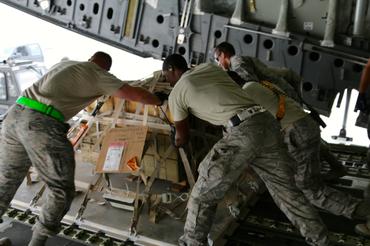 U.S. Air Force personnel unload a C-17 cargo plane at an undisclosed location in the Persian Gulf region. 