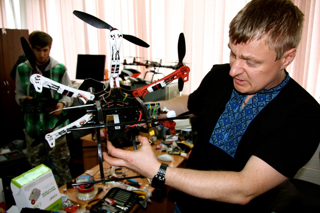Kyiv IT Academy Step program director Ivan Dovgal holds a small drone inside the school’s drone workshop, which he oversees.(Photo: Nolan Peterson/The Daily Signal)