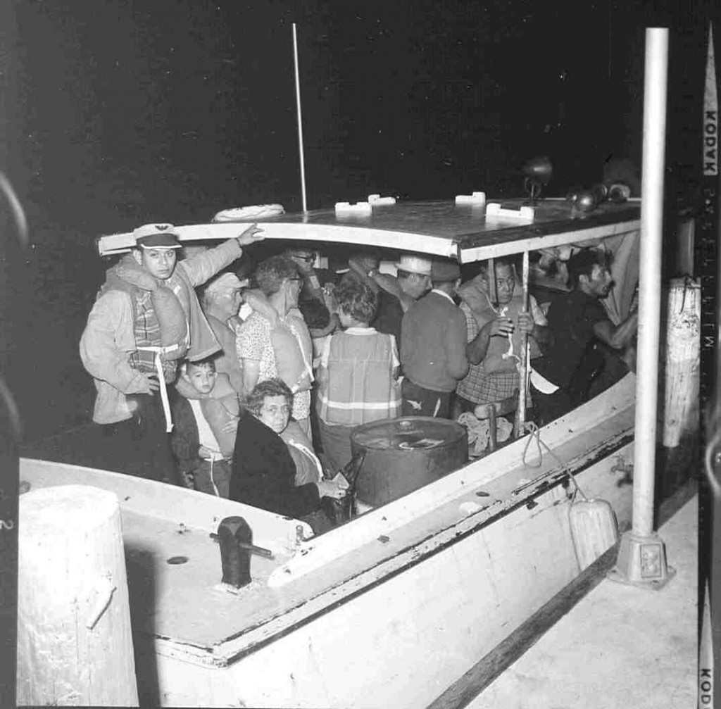 In a converted fishing boat, a Cuban family waits to set sail for Florida. (Photo: U.S. Coast Guard Camarioca Boatlift Collection) 