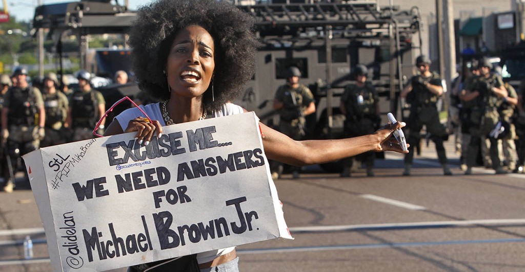 A protester makes her voice heard as a march organized by area ministers makes its way through Ferguson, Mo., on Wednesday, Aug. 13. (Photo: J.B. Forbes/St. Louis Post-Dispatch/MCT) 