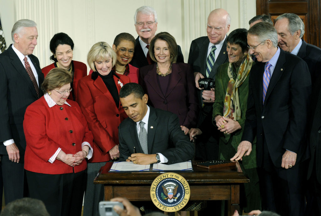 President Barack Obama signs the Lilly Ledbetter Fair Pay Restoration Act nine days into his presidency, on Jan. 29, 2009. (Photo: Kevin Dietsch/UPI/Newscom)