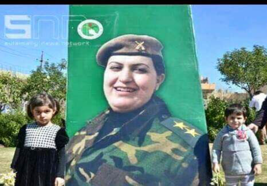 Captain Rengin Yousef, killed in action, and her two children. (Photo courtesy of the 2nd Battalion)