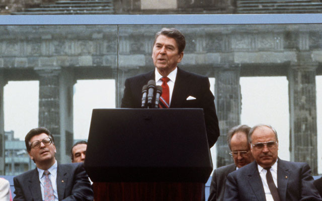 US President Ronald Reagan speaks in front of Brandenburg Gate in Berlin, June 12 1987 (Dieter Klar/picture-alliance / dpa/Newscom)