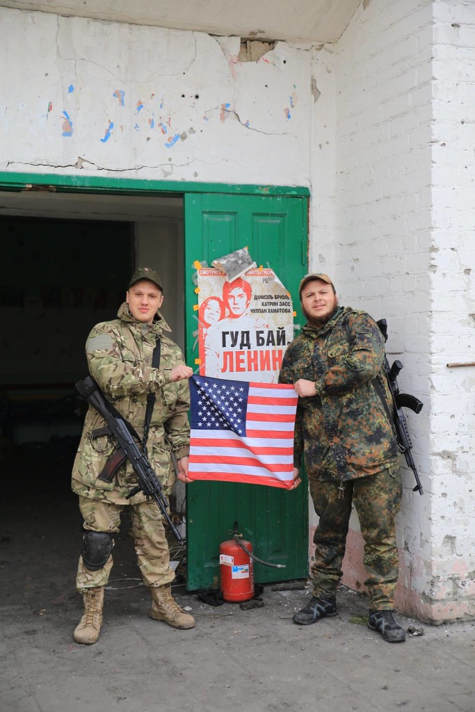 Ukrainian Azov Battalion soldier Ivan Kharkiv (right) and another soldier in front of a poster that says “Bye, Bye Lenin.” (Photo courtesy Ivan Kharkiv)