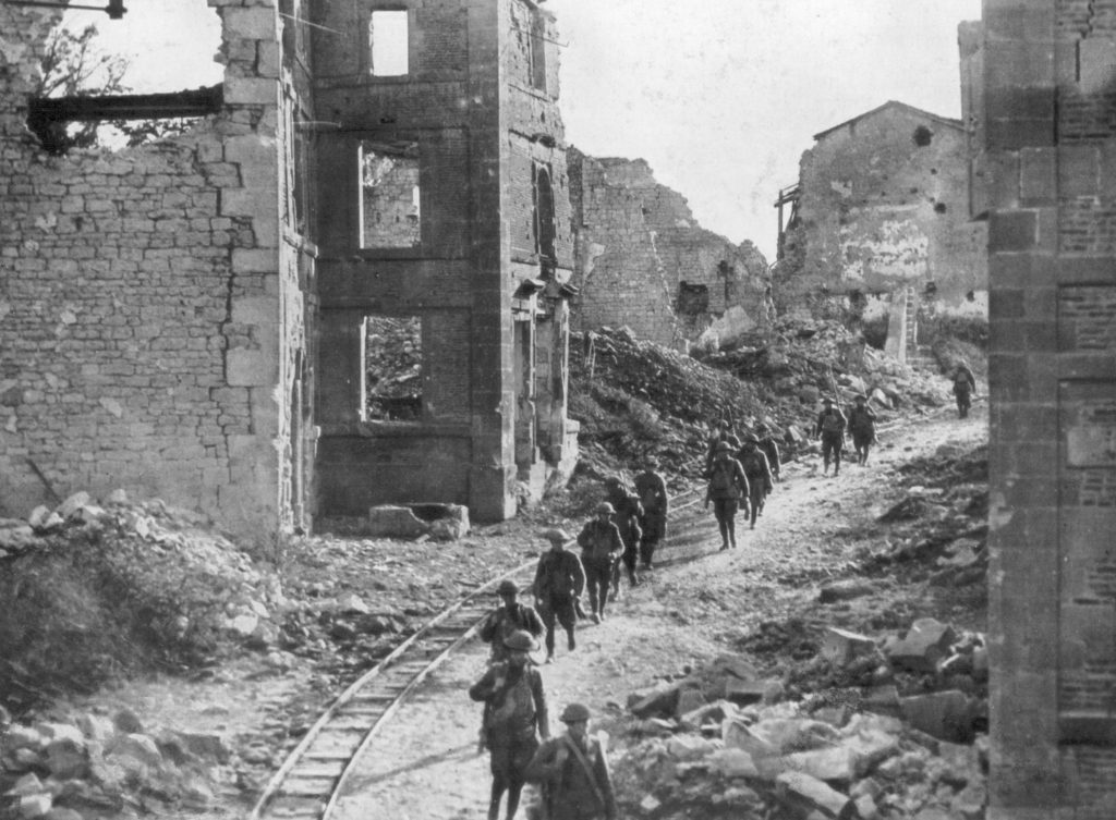 American soldiers passing through the ruins of Varennes, France during the Meuse-Argonne offensive. (Photo: The Print Collector Heritage Images/Newscom)